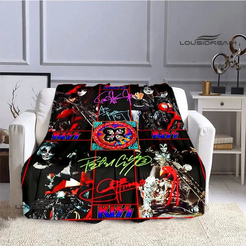 A black and red printed flannel throw blanket featuring the Kiss band logo and artwork.