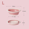 A pink foldable travel wash basin shown with dimensions of 28cm by 8.5cm and a depth of 17.5cm.