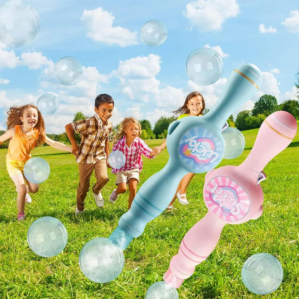 A pink and blue magic smoke bubble machine is being used outdoors with many clear bubbles floating in the air.