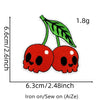 A pair of red cherry embroidered iron-on patches showing the fruit and stem.