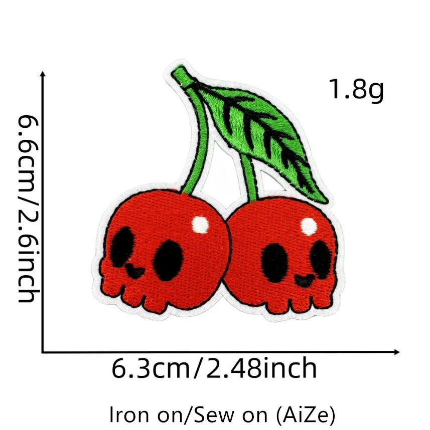 A pair of red cherry embroidered iron-on patches showing the fruit and stem.