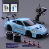 A blue Super Racing RC drift truck is shown with accessories like charging cables, tires, and a triangular barrier.
