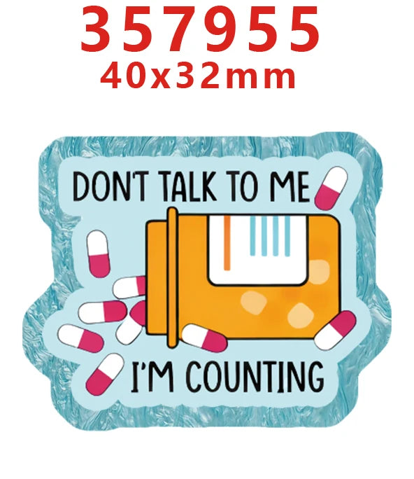 A set of glitter acrylic nurse badge charms with the number 357955 and size 40x32mm, featuring pills.
