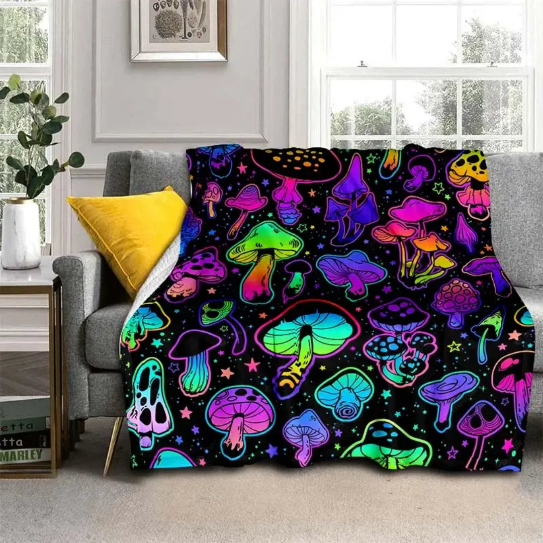 A colorful print flannel throw blanket featuring various stylized mushrooms in neon and vibrant colors.