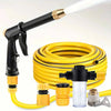 A yellow high-pressure car wash gun with an adjustable nozzle and hose coiled nearby.
