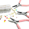 A set of pink jewelry making tools including pliers, tweezers, and a ring sizer are displayed on a white background.