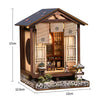 A wooden miniature Japanese sakura tea house kit featuring detailed architecture and an LED light.