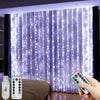 A hand holds a remote control for USB LED curtain string lights illuminating sheer purple fabric indoors.