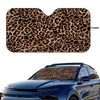 Leopard print car windshield sunshade applied to a blue car windshield.