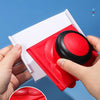 A hand holds a red replacement pad for an edger brush, showing the white and black bristles.