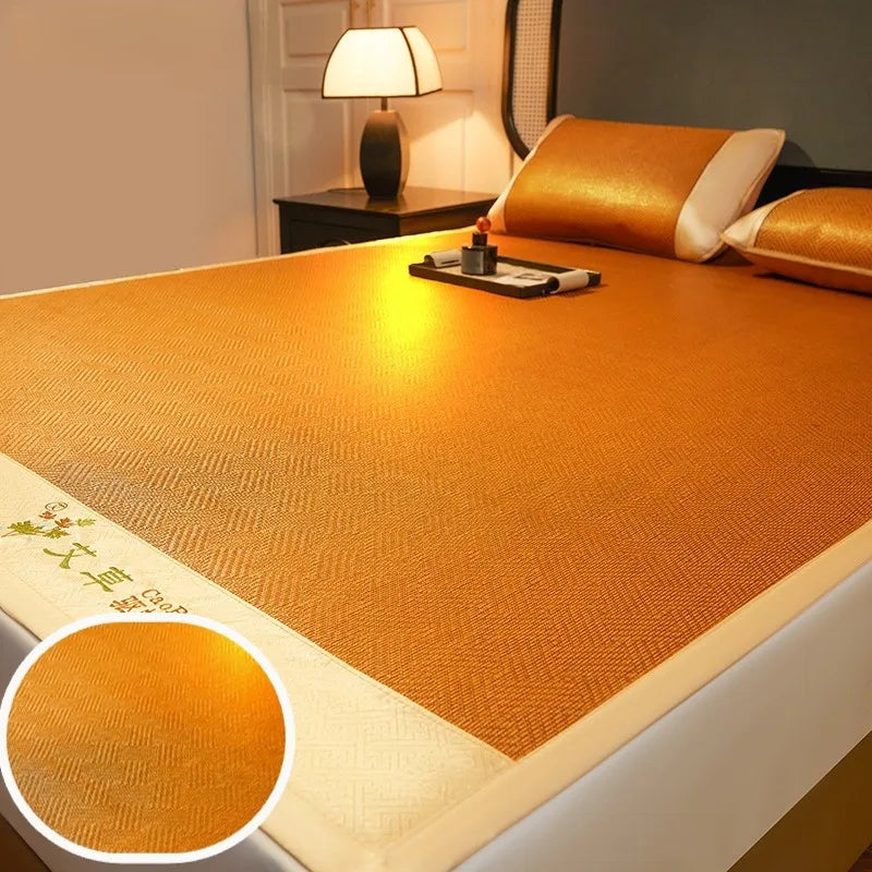 A close-up view of an orange cooling mat with a textured surface and a white border, placed on a bed.