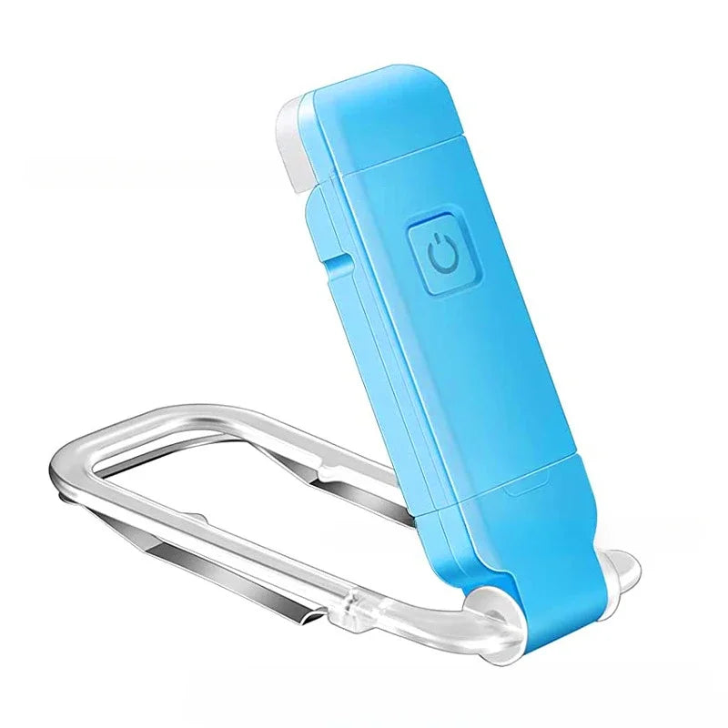Luz de libro clip con gancho metálico plateado azul claro.