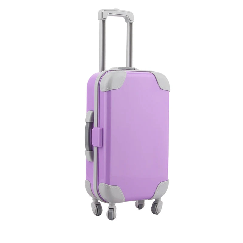 A purple and gray doll travel suitcase with a silver handle and wheels.