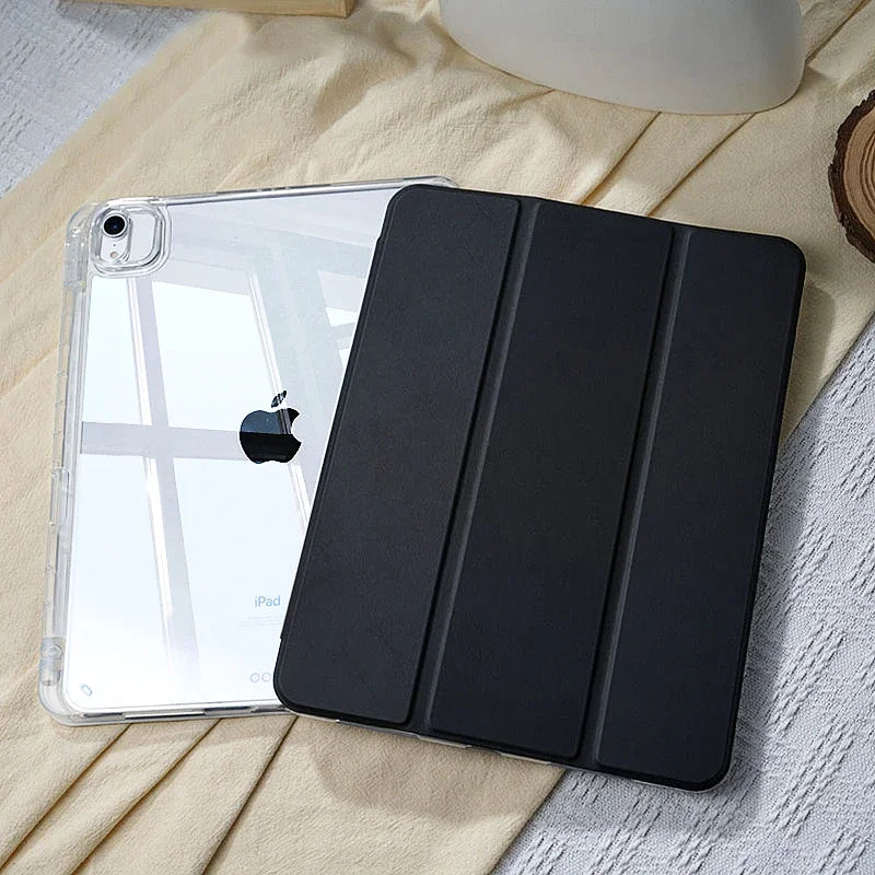 A black slim protective iPad case with built-in pencil holder resting on a light yellow fabric.