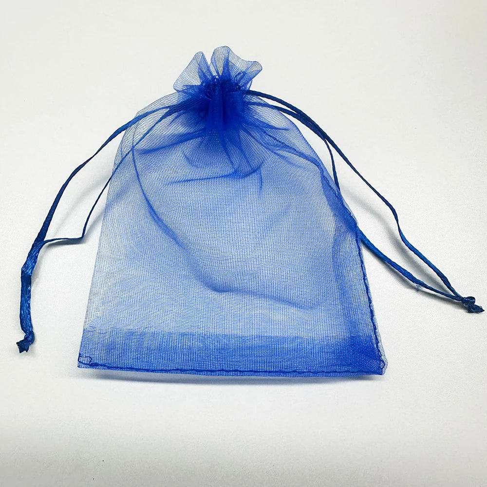 A translucent blue organza drawstring bag for gifts or party favors.