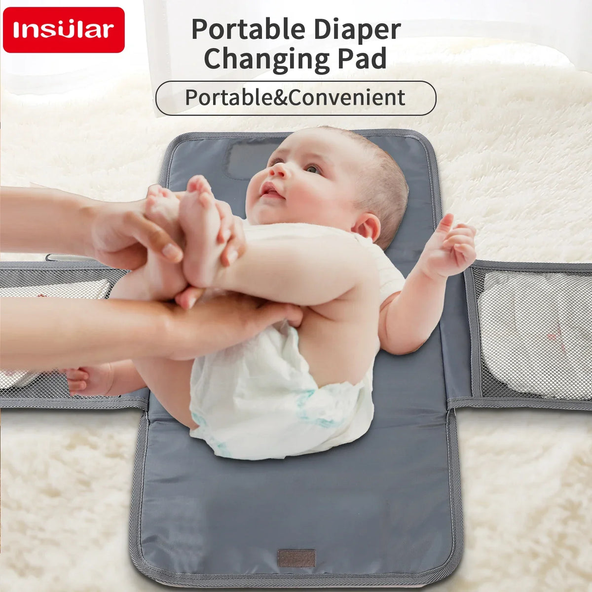 A baby is being changed on a portable diaper changing pad with a waterproof cover and storage bag.