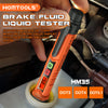An orange brake fluid liquid tester is shown being used in a car engine bay.