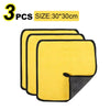 Three yellow microfiber cleaning towels with black edges shown from above.