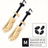 Pair of adjustable wooden shoe stretchers with black handles for men and women