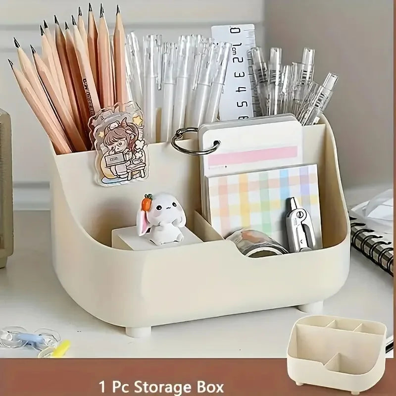 A beige storage box filled with various pens, pencils, and office supplies like markers and rulers.