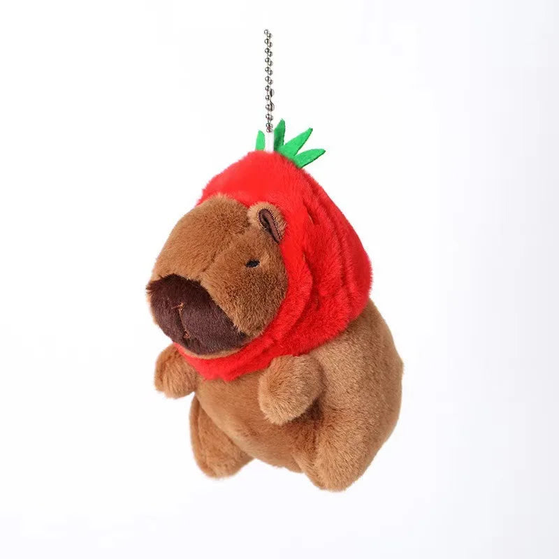 A brown plush toy resembling a capybara with red ears and a yellow duck swim ring attached to the top.