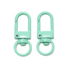 A pair of light mint green alloy lobster clasp hooks for DIY jewelry making.