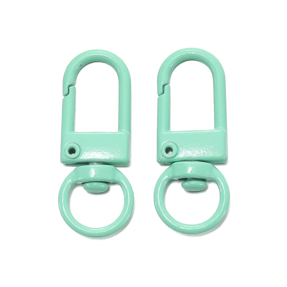 A pair of light mint green alloy lobster clasp hooks for DIY jewelry making.