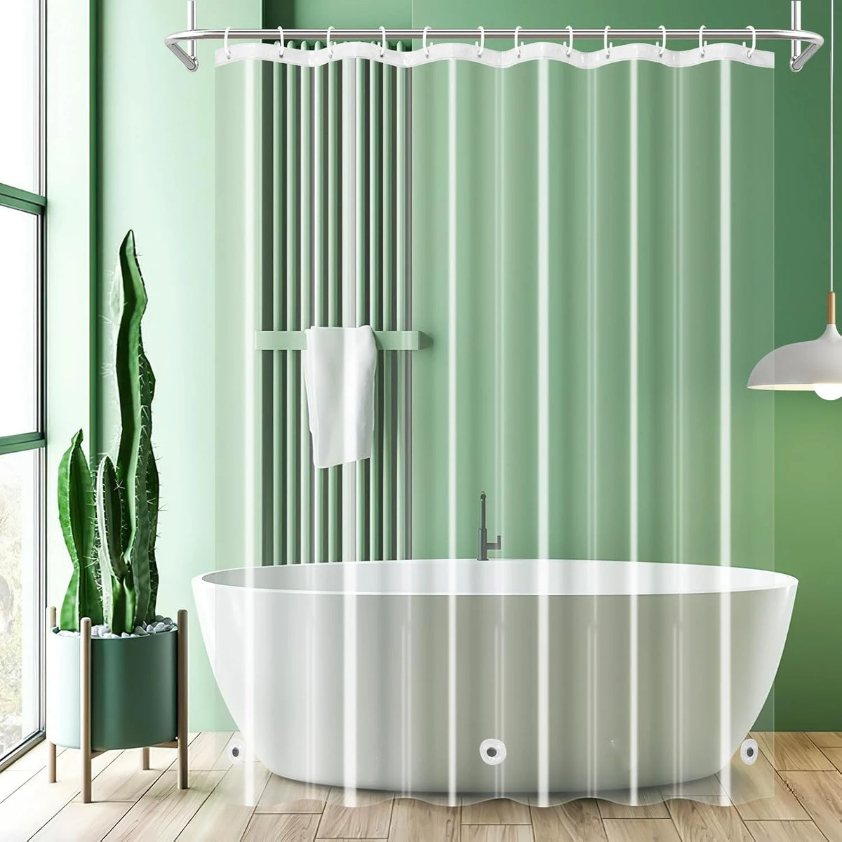 A modern bathtub setup featuring a glass shower curtain liner and a hanging shower rod in a light green bathroom.