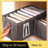 A gray foldable closet organizer box filled with neatly folded white underwear and socks.