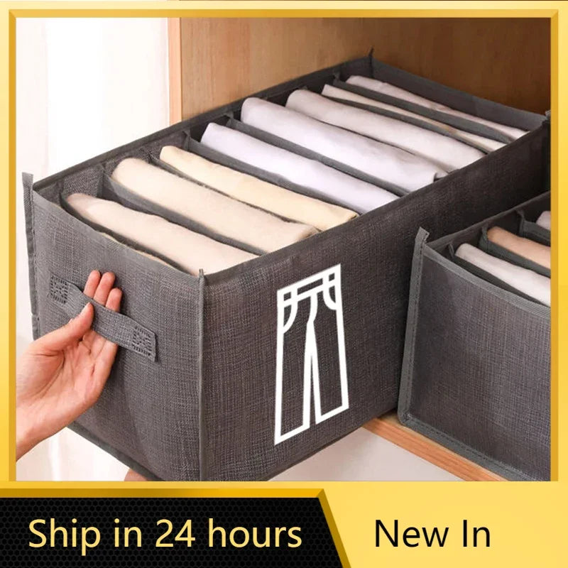 A gray foldable closet organizer box filled with neatly folded white underwear and socks.