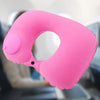A bright pink self-inflating travel neck pillow with a soft flocking cover shown in a close-up view.