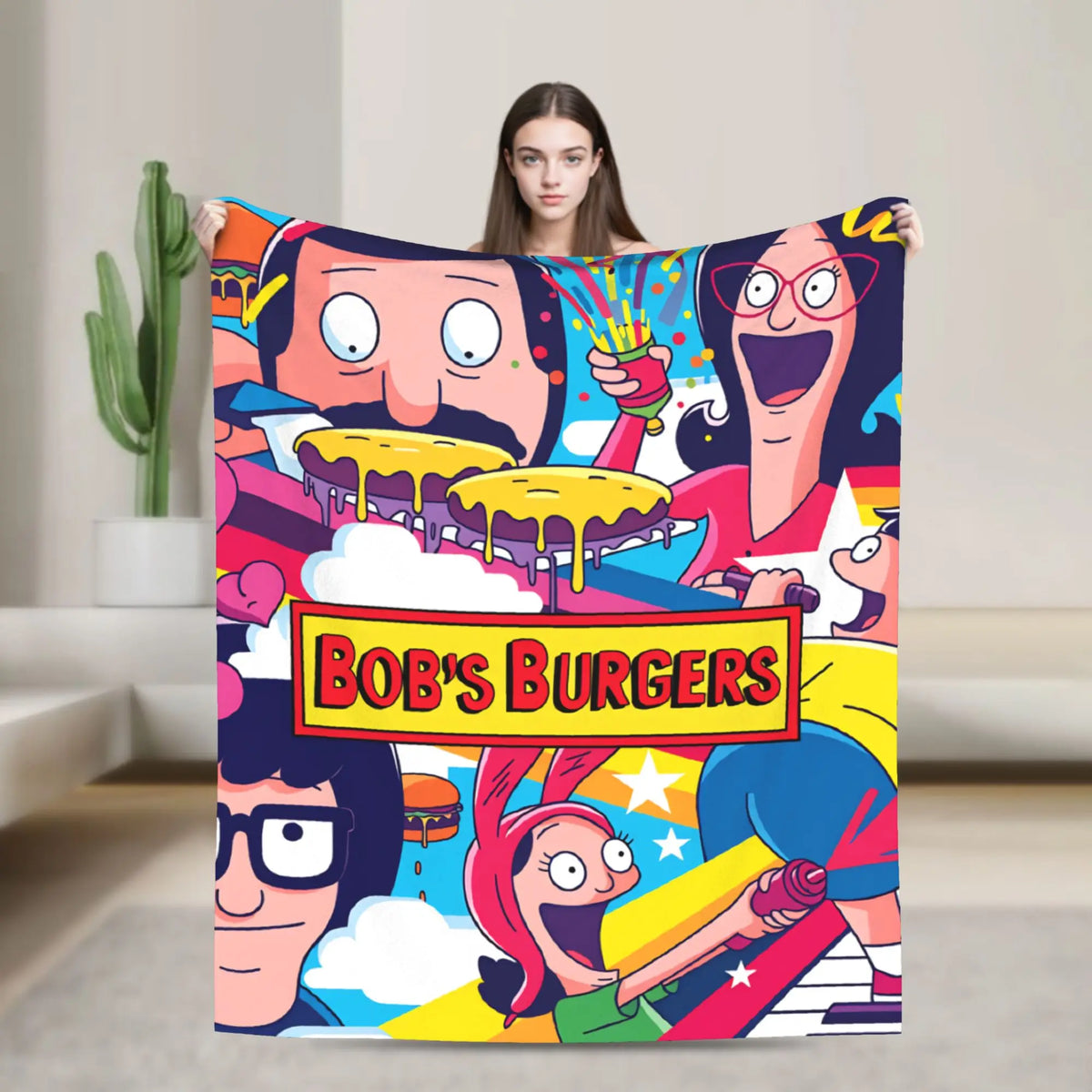 A colorful cartoon blanket featuring characters from Bob's Burgers, including a smiling man and woman.