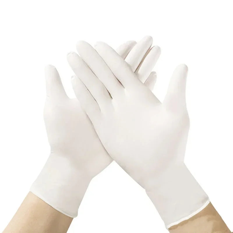 A hand wearing a white disposable nitrile glove is shaking another hand.