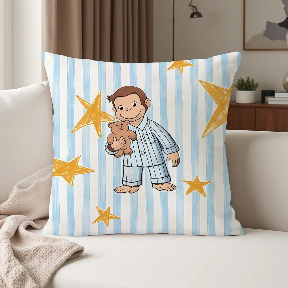 A decorative pillow featuring a cartoon illustration of George and a monkey surrounded by yellow stars on a blue and white st