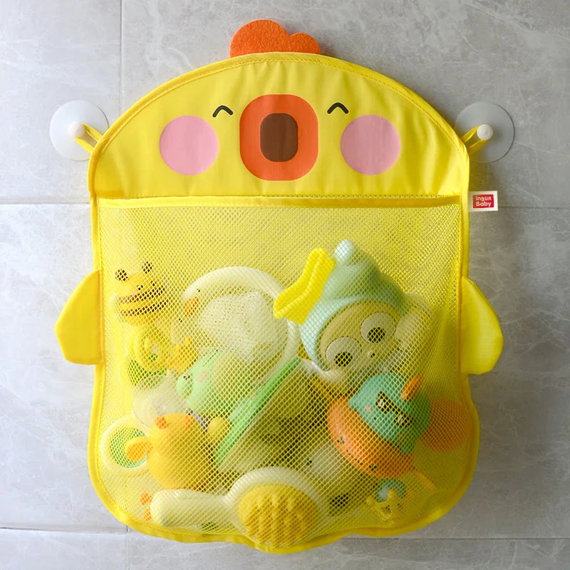 A yellow cartoon duck bath toy storage mesh bag with suction cups filled with various bath toys.