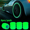 Four luminous green glow-in-the-dark tire valve caps are shown next to a close-up of a car wheel.