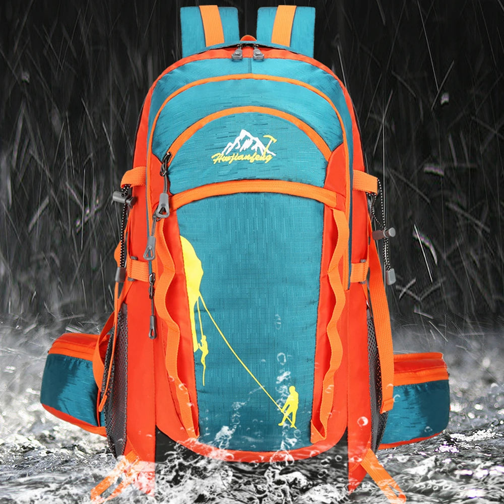 An orange and teal hiking backpack is shown in a snowy outdoor environment.