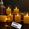 A collection of glowing yellow LED tea light candles in glass holders, with a remote control visible nearby.
