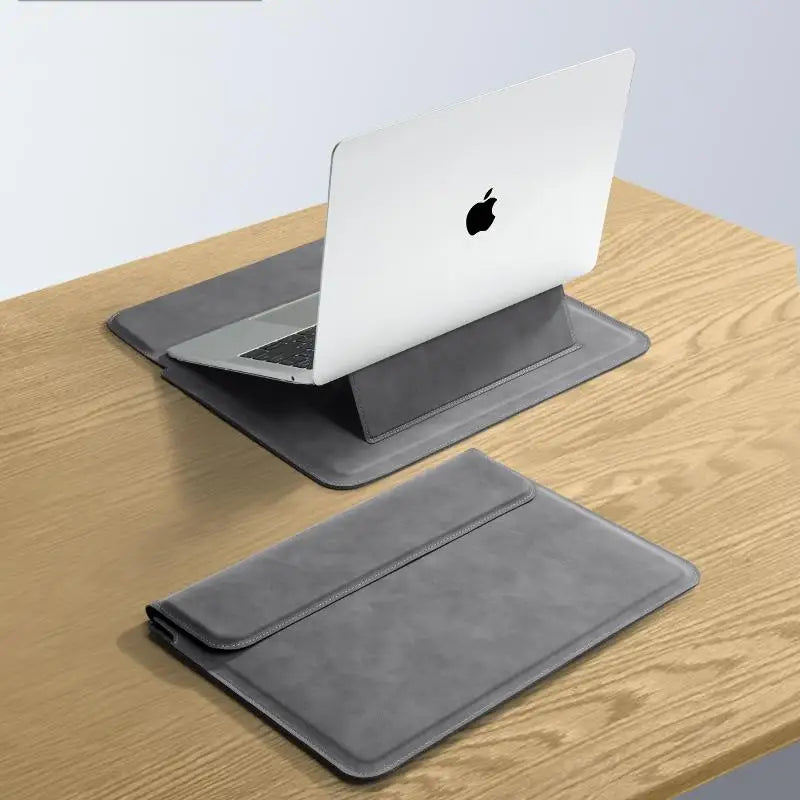 A silver laptop is placed inside a gray protective sleeve case on a wooden surface.