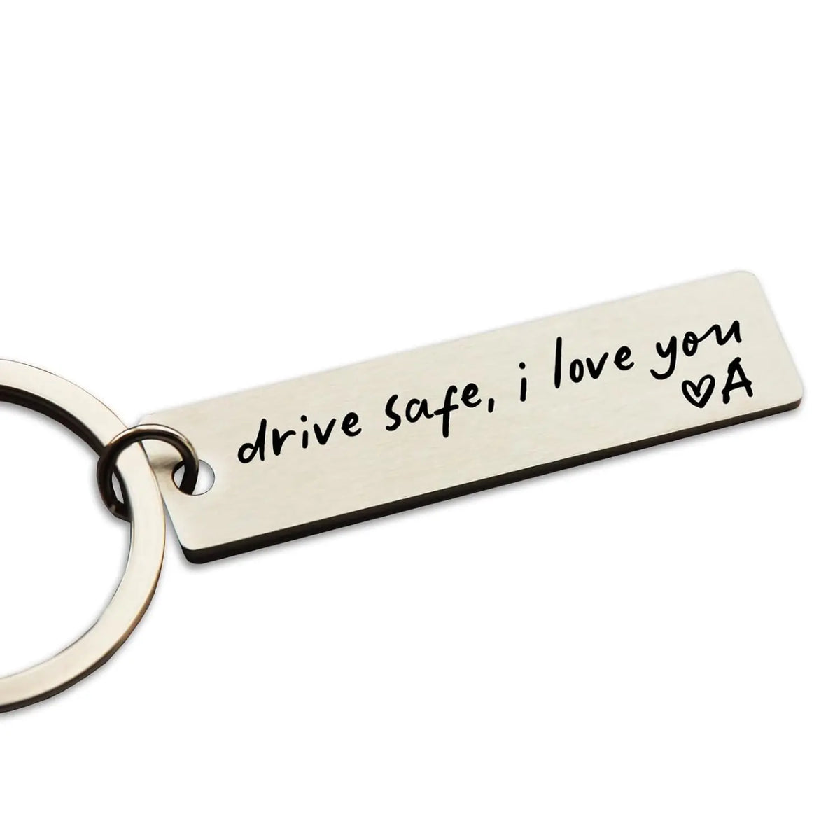 A personalized stainless steel keychain engraved with the message drive safe i love you and a heart.