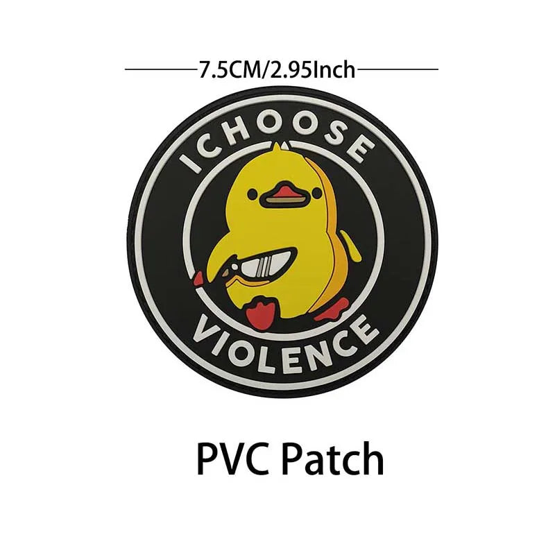 A black circular PVC patch featuring a yellow penguin with an open mouth, surrounded by text that reads ICHOOSE VIOLENCE.