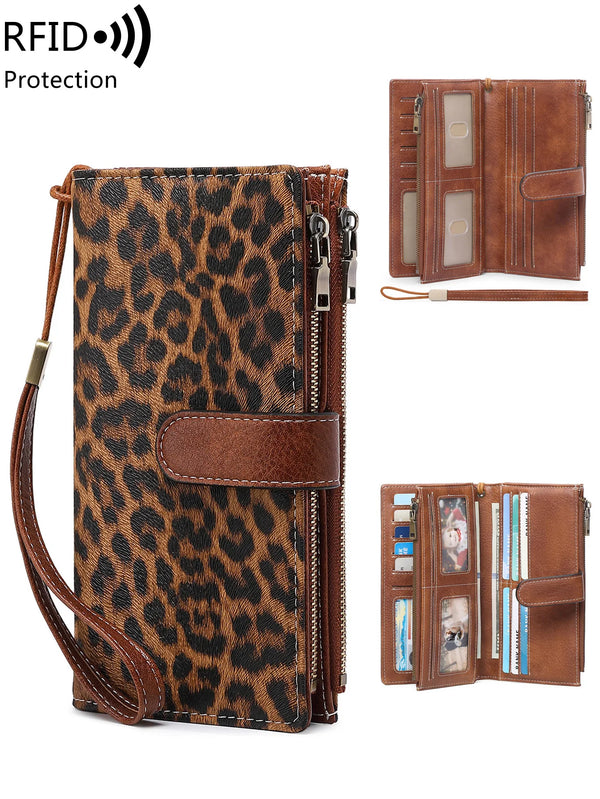 A brown leopard print RFID-blocking long wallet with a leather wristlet strap and clear card slots.