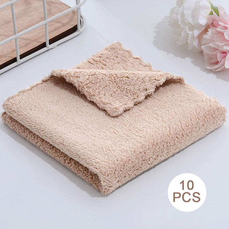 A stack of ten ultra-soft coral velvet face towels is displayed on a white surface.