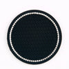 Black diamond pattern coasters with a silver border and studs.