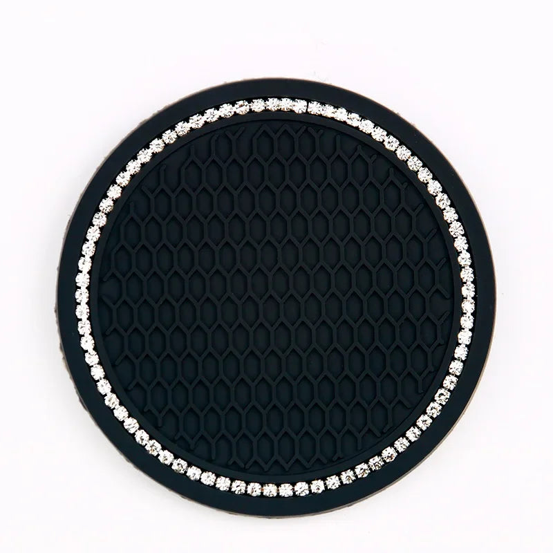 Black diamond pattern coasters with a silver border and studs.