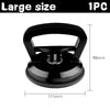 A black heavy duty car dent puller kit with two suction cups shown from above.