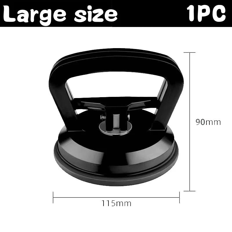 A black heavy duty car dent puller kit with two suction cups shown from above.