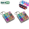 Two sets of colorful LED fidget keychains with a keyboard design and metal clasps.