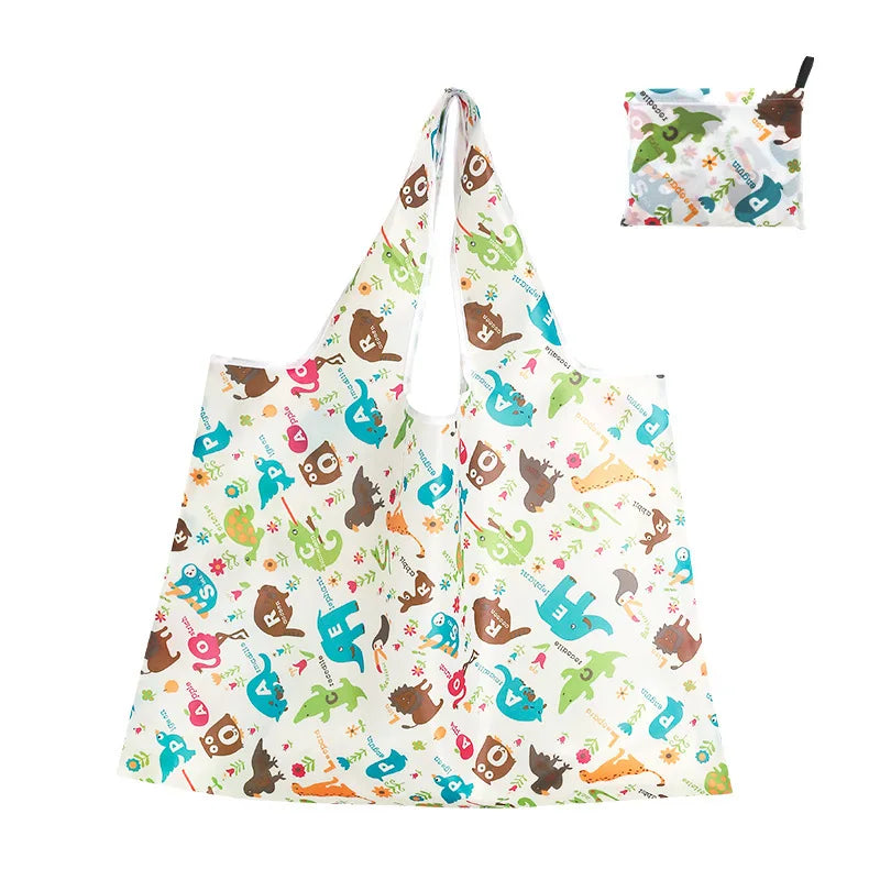 A white reusable shopping tote bag featuring colorful dinosaur and nature-themed prints.