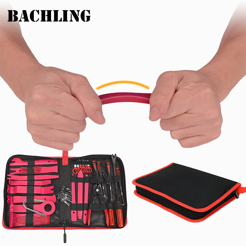 A hand holds a red silicone trim removal tool, demonstrating the use of a 38-piece auto trim removal tool set with storage ba